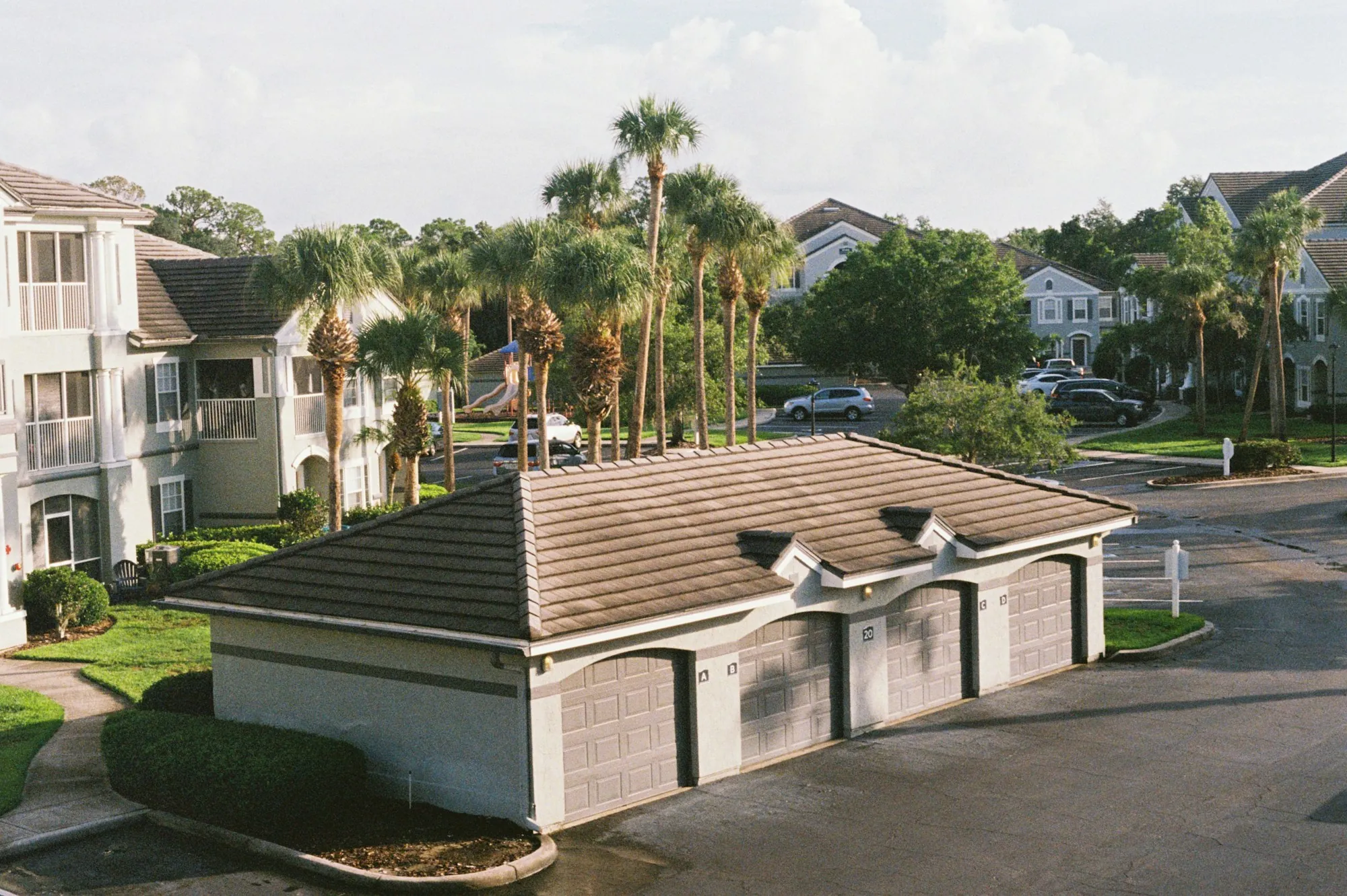 A South Florida street of houses and palm trees seen from above